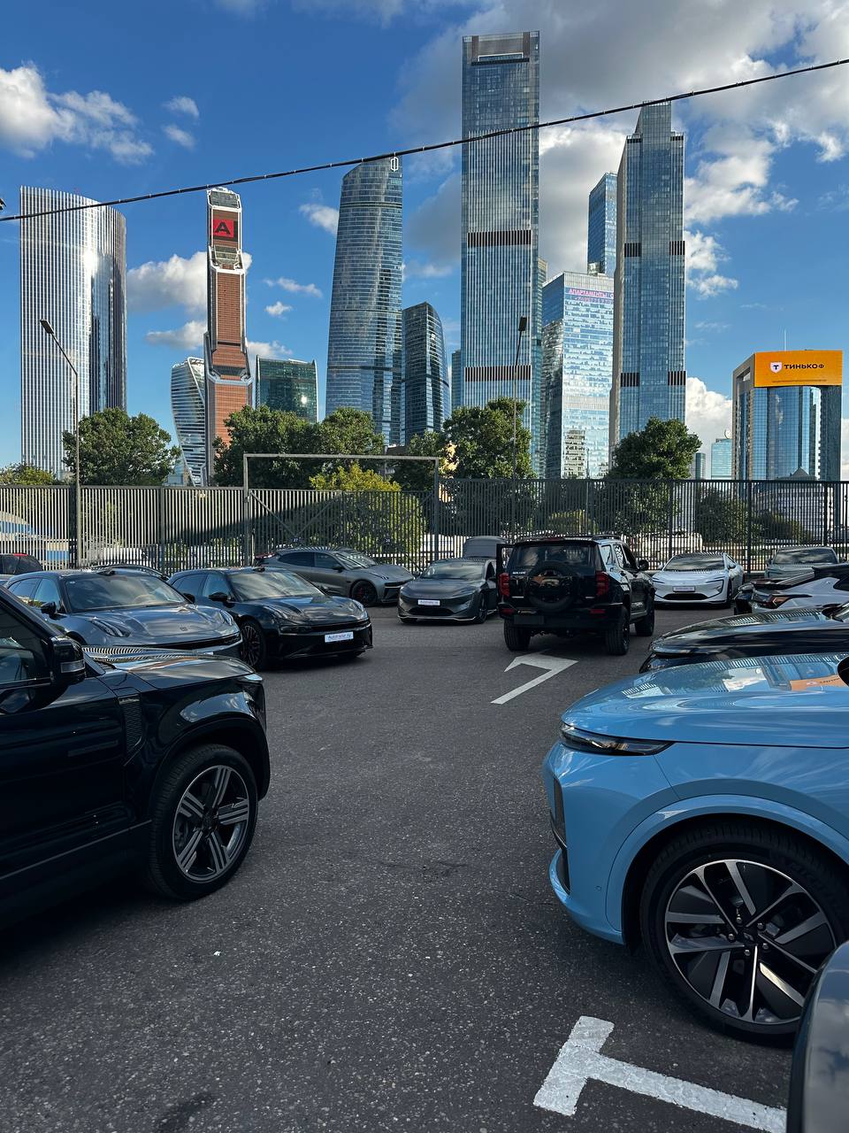 AutoTrader.ru cars against the Moscow City skyline
