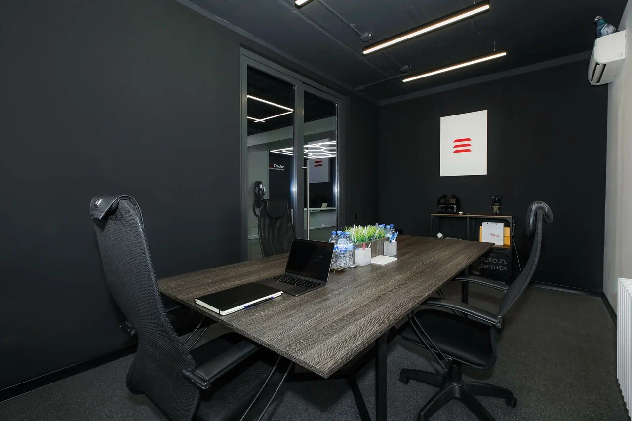 AutoTrader meeting room in a dark graphite style